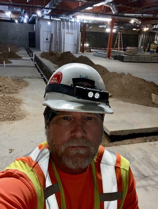 Matthew Smith, Founder and CEO of Documint PM, on an active MEP construction site